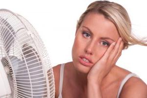 woman-cooling-off-in-front-of-fan