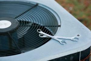 air-conditioner-with-wrench-placed-on-top